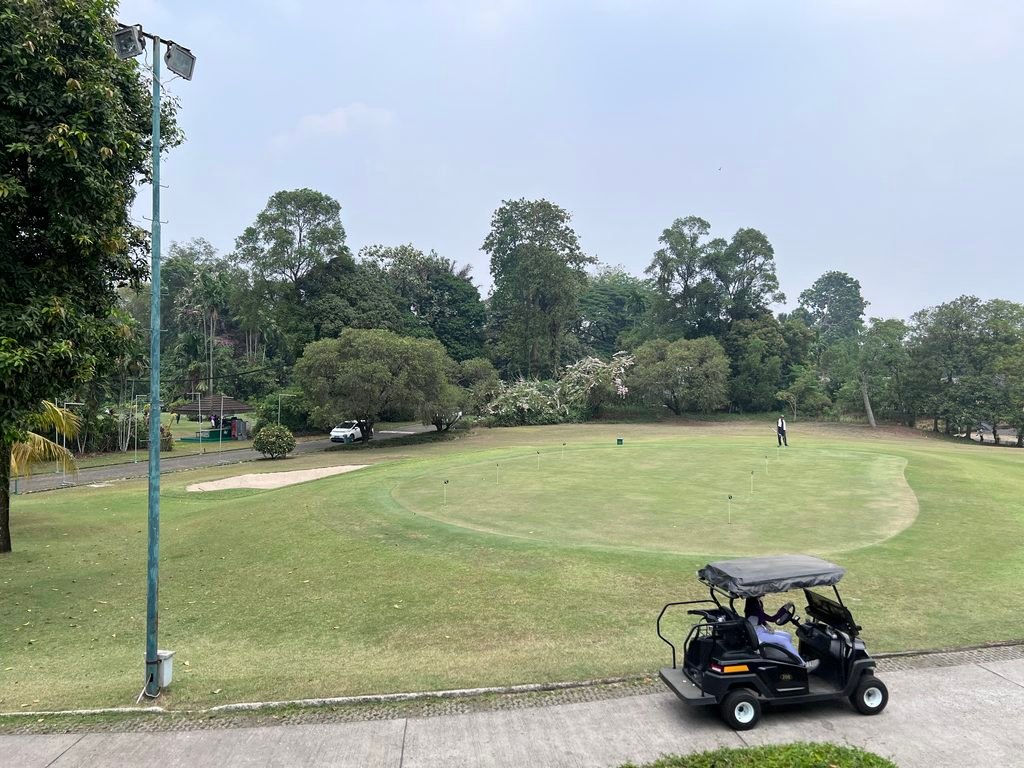 Jagorawi Golf & Country Club practice green and golf carts in Bogor